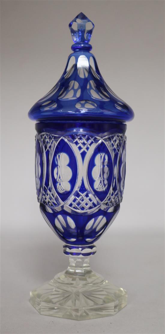 A blue overlaid glass vase and cover